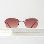 Ribotti Remake Britney unisex sunglasses - minimalist retro Y2K style, rimless gold frame, rose tinted lenses