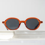 Ribotti Remake Léon Nikita unisex sunglasses - timeless minimalist 90s style, round brown frame, grey tinted lenses