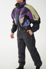 One piece vintage Descente ski suit snow suit noir avec accents mauve, vert et bleu pour homme taille M