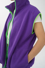 Veste sans manche en polar mauve et vert fluo taille L
