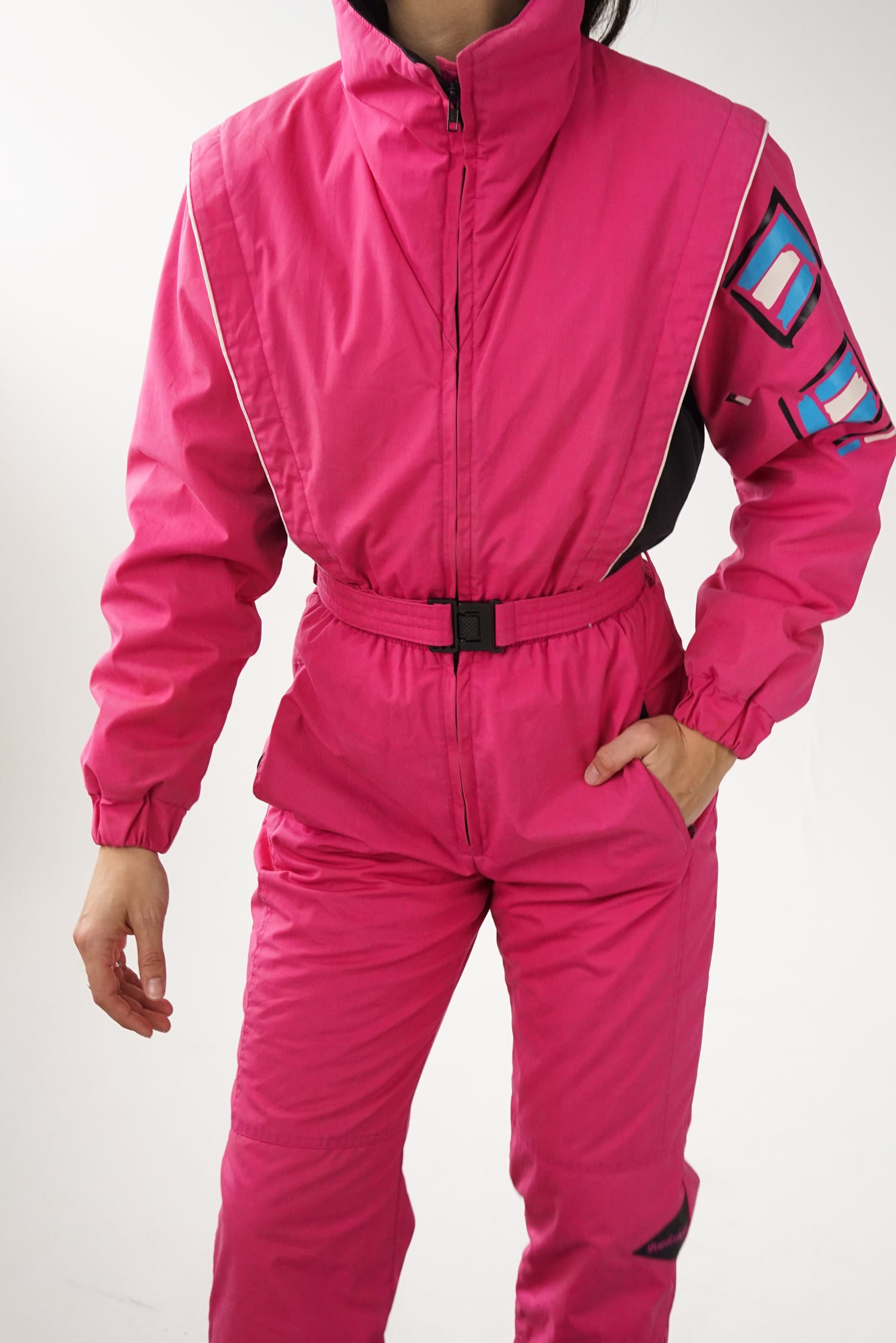 One piece Powderhorn ski suit, snow suit rose pour grande femme (XS) usé*