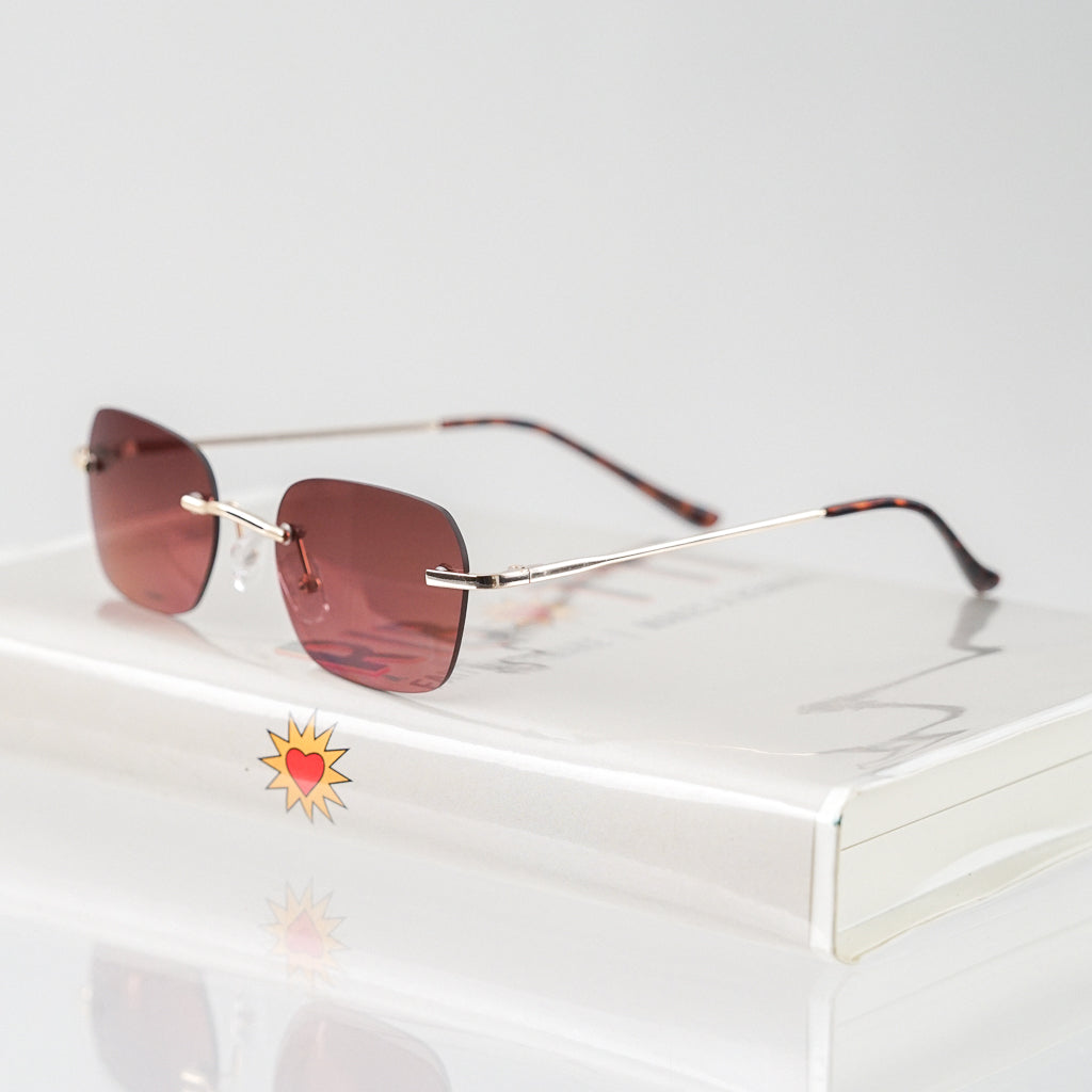 Ribotti Remake Britney unisex sunglasses - minimalist retro Y2K style, rimless gold frame, rose tinted lenses