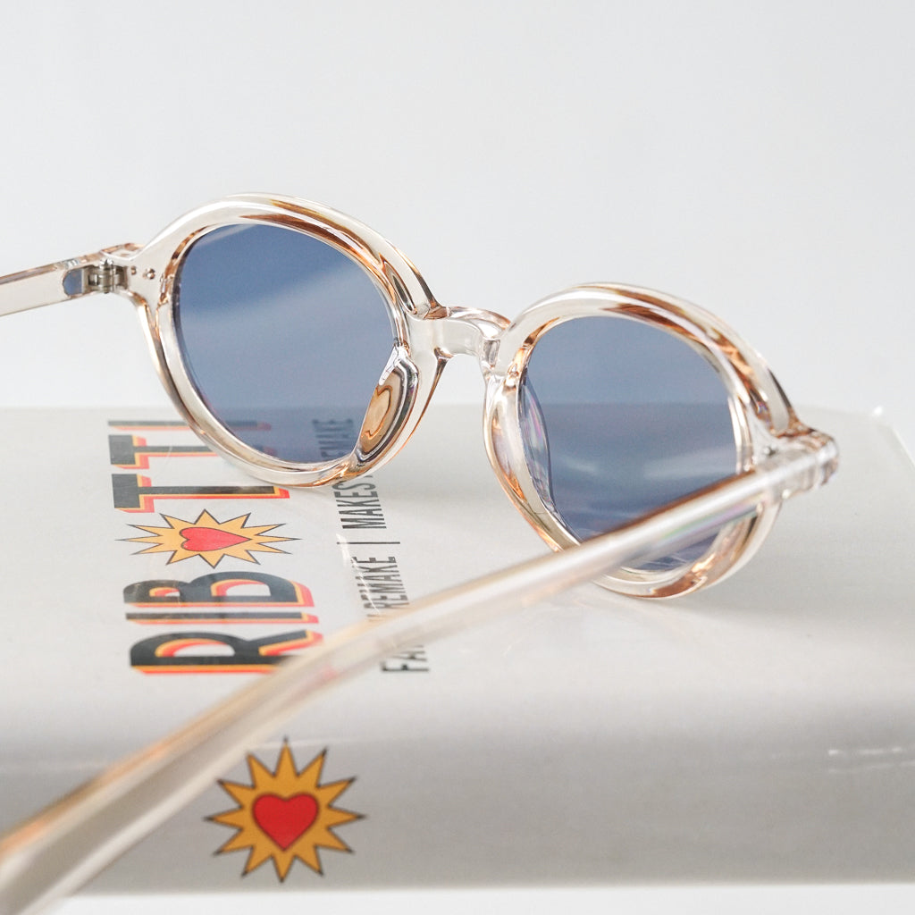 Ribotti Remake Léon Lepro unisex sunglasses - timeless minimalist 90s style, round clear frame, blue tinted lenses 