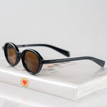 Ribotti Remake Léon Mathilda unisex sunglasses - timeless minimalist 90s style, round black frame, brown tinted lenses 