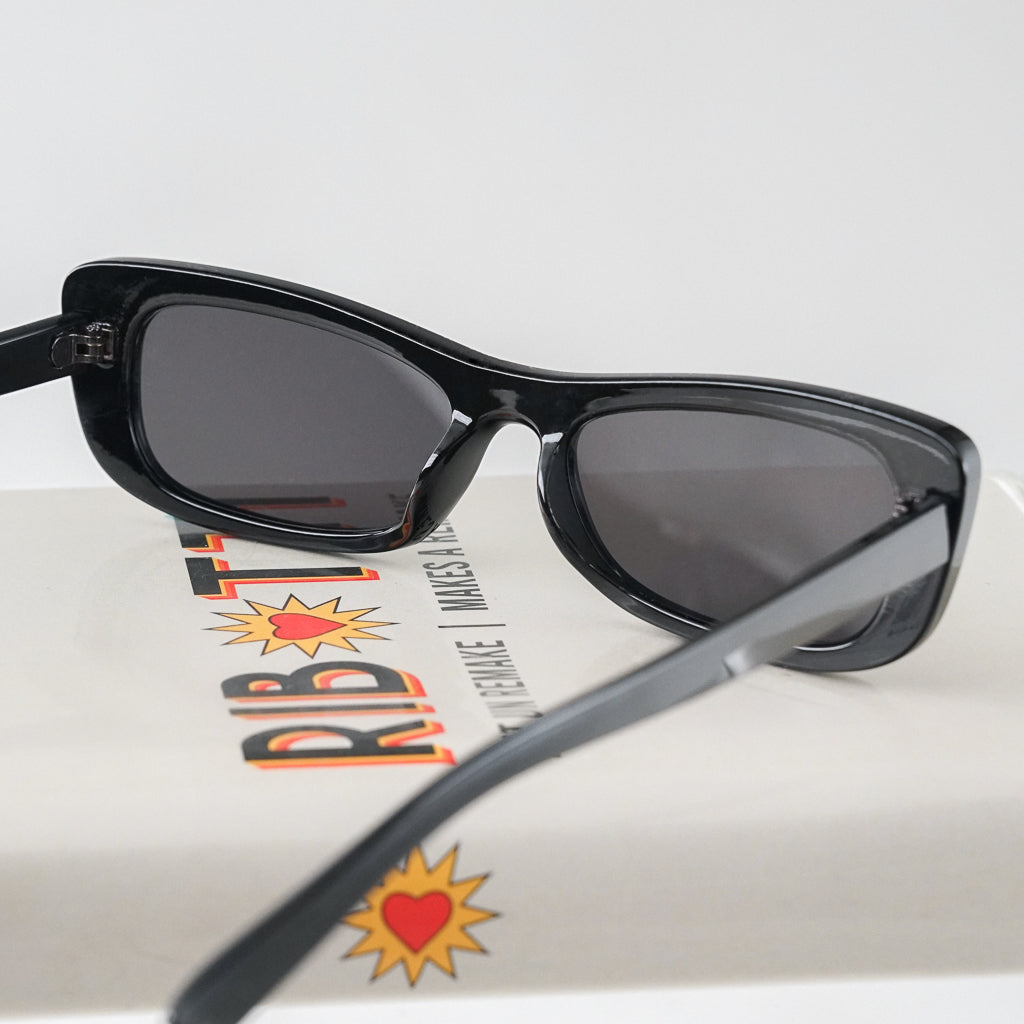 Ribotti Remake Spy Carmen unisex sunglasses - black rectangular cat-eye frame, black tinted lenses, retro-futuristic minimalist 2000s style 