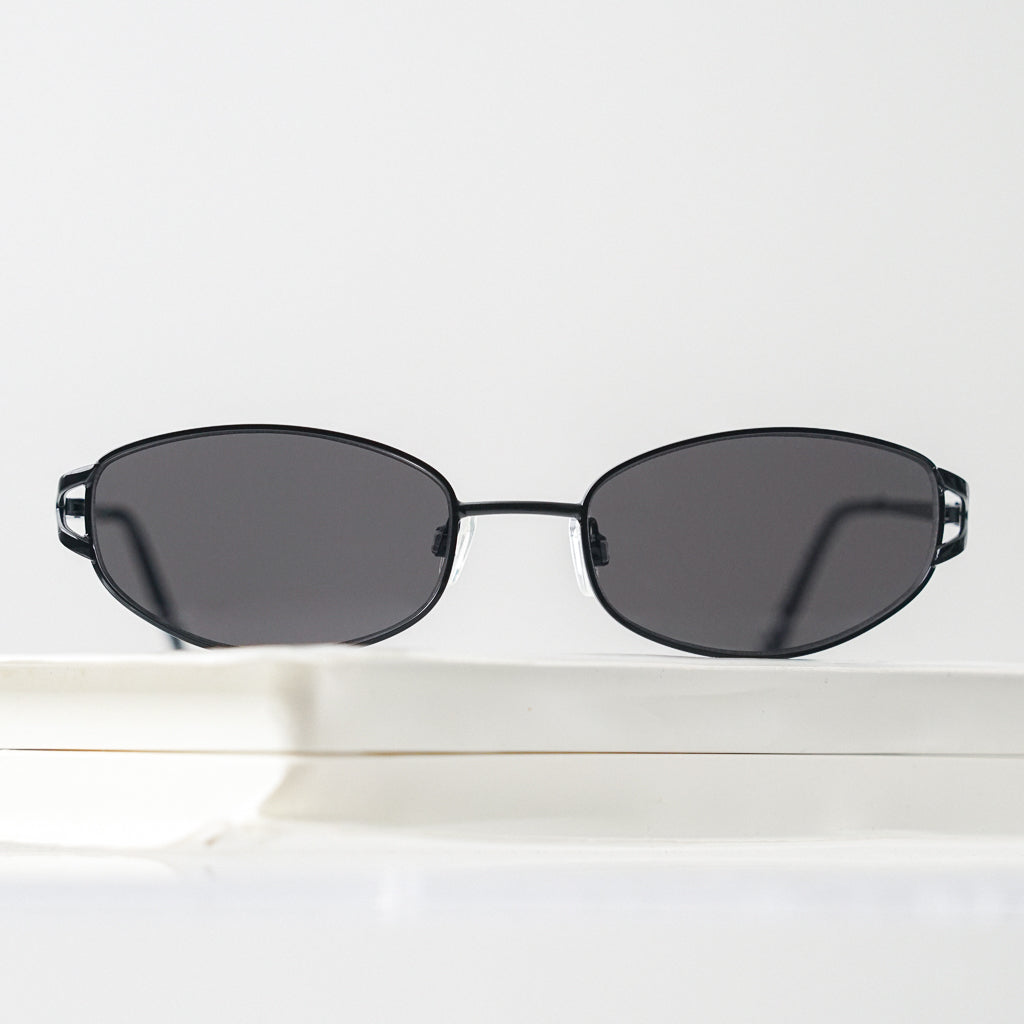 Ribotti Remake Spy Juni unisex sunglasses - black oval frame, black tinted lenses, retro-futuristic minimalist 2000s style 