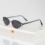 Ribotti Remake Spy Juni unisex sunglasses - black oval frame, black tinted lenses, retro-futuristic minimalist 2000s style 