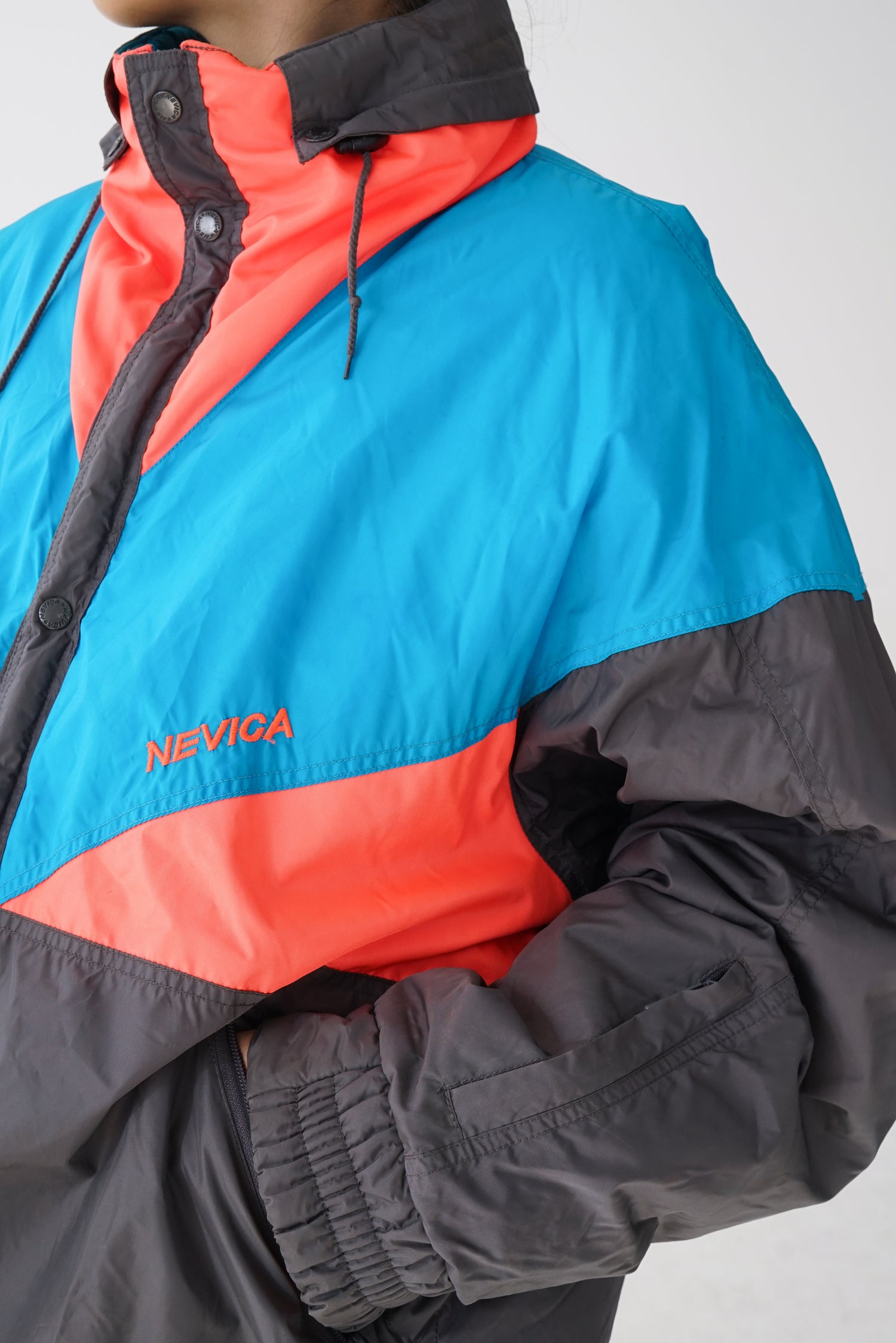 Manteau de ski vintage Nevica gris et bleu/orange fluos pour homme taille 44 (L)