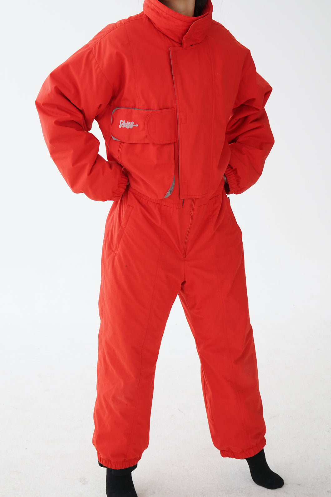 One piece Skiss ski suit, snow suit rouge pour homme taille L-XL