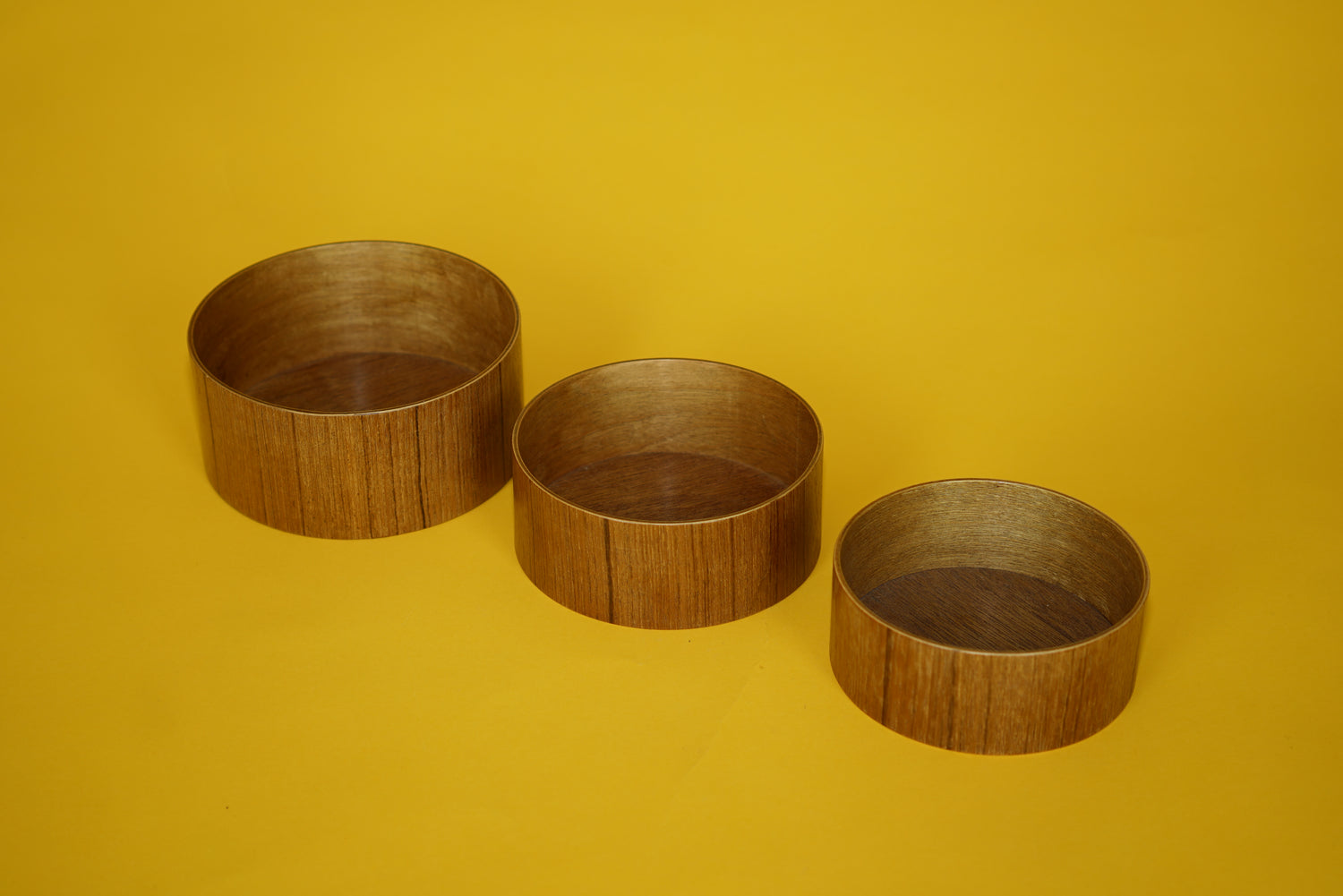 Trio of teak bowls