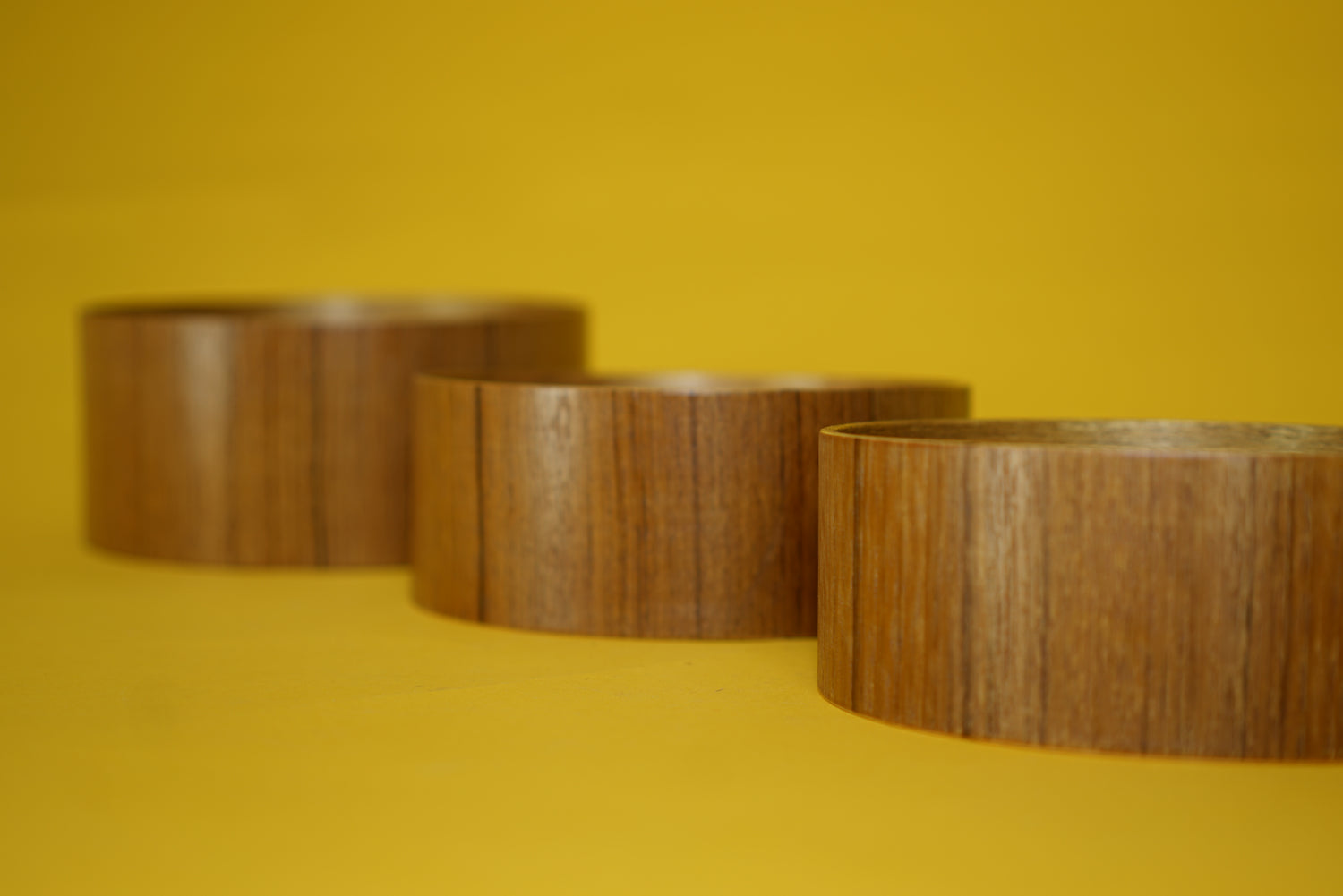 Trio of teak bowls