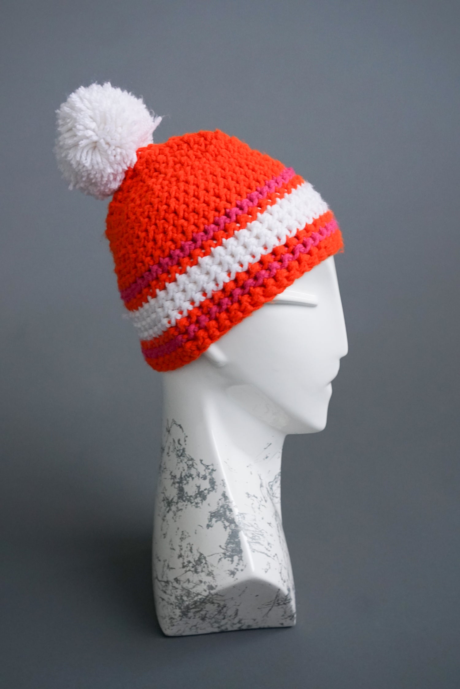 Handmade orange pom-pom beanie