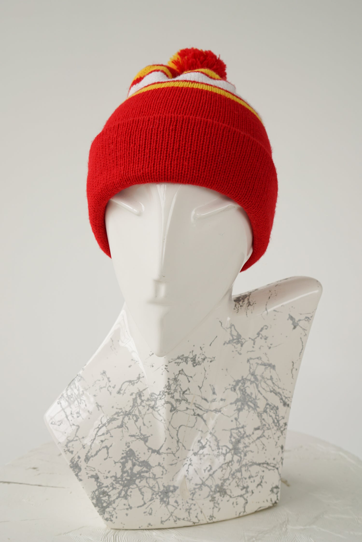 Red with white and yellow stripes beanie with pom-pom size S-M
